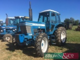 1982 Ford 8200 Dual Power 4wd tractor with load monitor and Q cab on 12.4-24 front and 16.9R34 rear