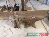 Steel anvil with a steel anvil on a wooden block