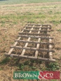 Horse drawn wooden frame harrows with straight metal teeth