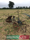 Single furrow reversible horse drawn plough with skimmers