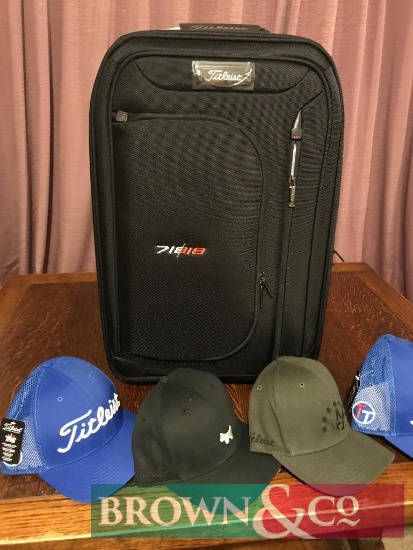 New Titleist wheeled roller travel bag with 4 baseball caps. Collection from any Brown & Co office.