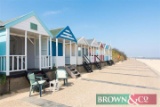 A day at a Beach Hut at Gun Hill end of Southwold beach on a date of the buyers choice with
