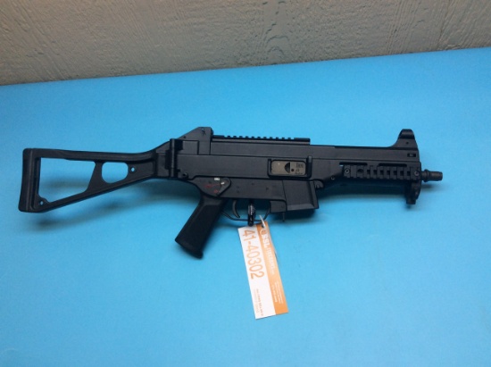 Heckler & Koch model UMP 45 Auto. Has option for 1 or 2 shot burst, feature