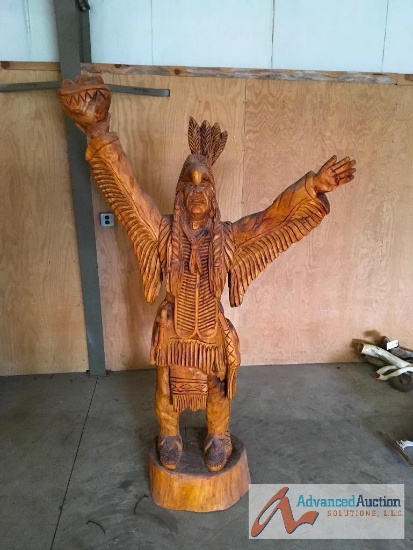 Wood carving of Indian with Eagle Head dress