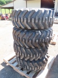 4 CAMSO 12-16.5 SKIDSTEER TIRES ON NEW HOLLAND RIMS ALL FOR ONE MONEY