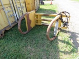 YELLOW SKIDSTEER ATTACH BALE GRABBER
