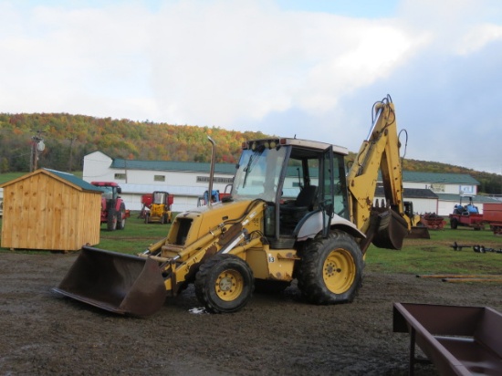 NEW HOLLAND 555E BACKHOE WITH A EXTEND A HOE