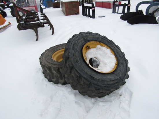 2 USED SKIDSTEER TIRES 12-16.5 ON NH RIMS