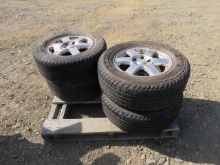 SET OF 4 P245/65R17 TIRES ON JEEP RIMS