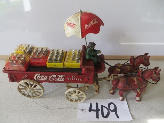 Cast Iron Coca Cola Claudsdale's beverage wagon 	w/man, umbrella and coca cola cases	& some bottles