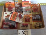 4 MF tractors, round baler, 2 disks, field cultivator, 2 MF wagons	original Old Ertl	Ertl	1/64 scale