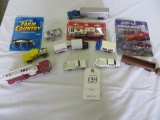 assortment of trucks, Uhaul, Spam, Coca Cola, Caterpillar and more