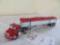 Custom semi with hydrolic hooks and canvas tarped grain trailer