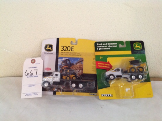 John Deere 320E With Peterbilt Model 367 Truck and Truck and Skid steer