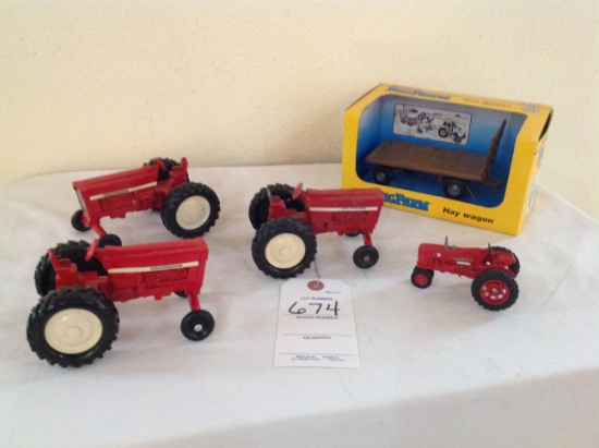 Ertl Big Farm Hay Wagon, and 4 international tractors - tractors are played