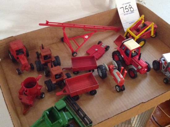 14 Pieces of miniture farm toys, some tractors, a mixer, some wagons, and m