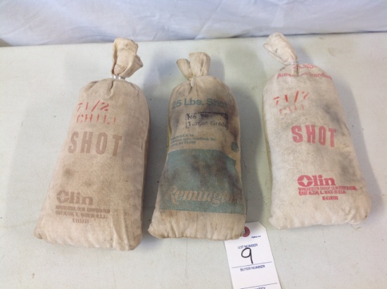 2 Olin & Remington empty shot bags preserved