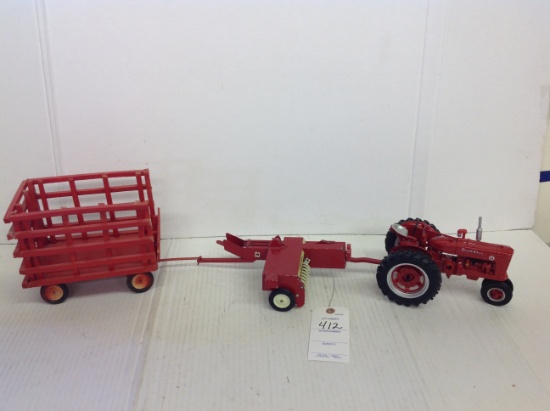 Farmall Super M tractor, International baler, and wooden red wagon