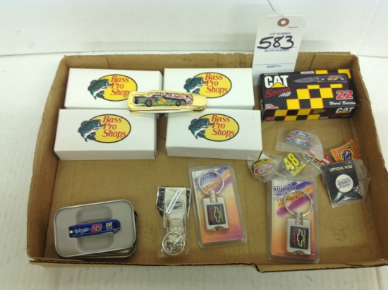 Bass Pro Shops Knives, random Key chains, and some pins