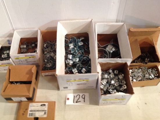 assorted sizes of metal pipe straps