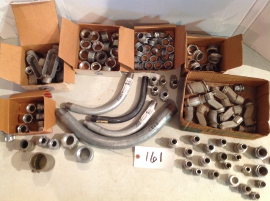 assortment of metal unions, bushings, metal cord connectors, and more