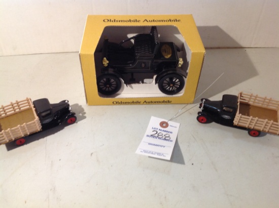 Oldsmobile car by Joe Ertl  and 2 1939 Stake trucks