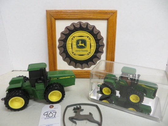 2 John Deere tractors w/John Deere tire patch emblem in a case