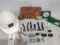 assortment of John Deere fobs, hard hat, belt buckles, money clip, key chains