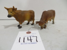 2 Brown cows one grazing by Schleich