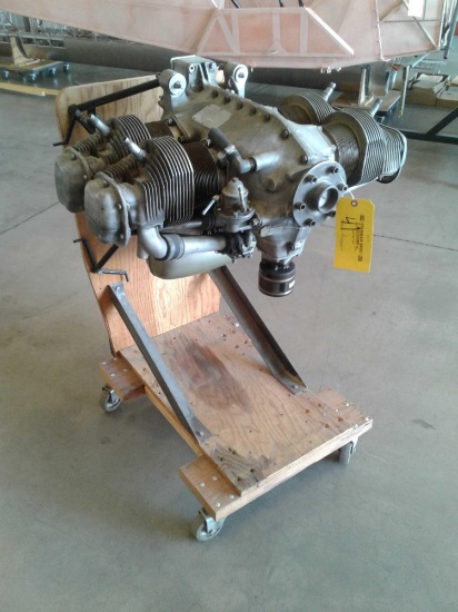 CONTINENTAL C90-16F ON STAND WITH LOG