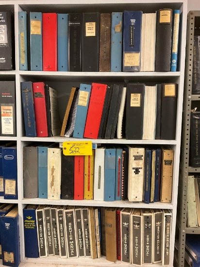 SHELVES OF MOONEY & PIPER MANUALS (DOES NOT INCLUDE SHELVES)