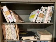 SHELVES OF CESSNA MANUALS (DOES NOT INCLUDE CABINET)