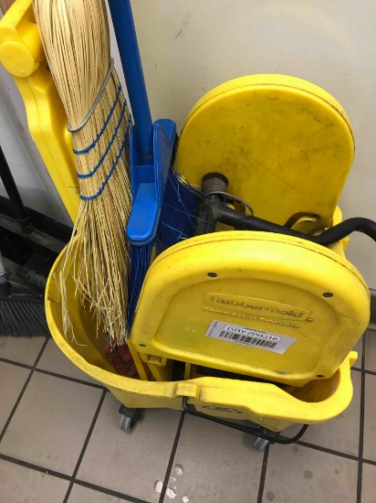 Lot of mops and brooms