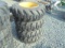 (4) New 10-16.5 SSL Tires & Rims, Cat Yellow 8 Bolt Rims
