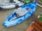 Blue Kayak With Paddles