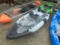 Green Kayak With Paddles