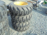 (4) New 10-16.5 SSL Tires & Rims, Cat Yellow 8 Bolt Rims