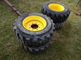 (4) New 12-16.5 SSL Tires On Yellow 8 Bolt Rims