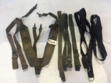 LOT OF MILITARY UTILITY BELTS AND STRAPS.