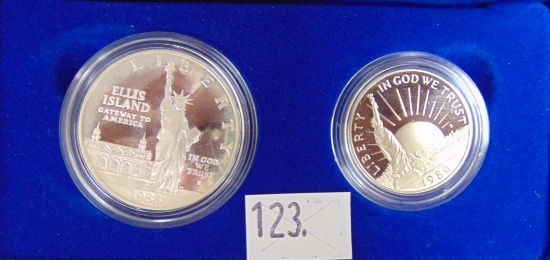 1986 Liberty Silver Dollar and clad Half Dollar.