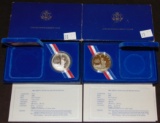 (2) 1986 Liberty Silver Dollars in cases, .900 fine Silver.