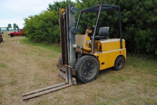 White Forklift, automatic transmission with high/low, goes up and down and has tilt (not side shift)