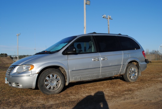 2005 Chrysler Town & Country van, silver exterior, check engine light is on, windshield is cracked,