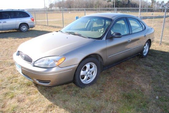 2004 Ford Taurus, 4-door, power locks & windows, owner states "purchased from Factor Ford in Le Cent