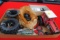 Box full of spare tires, wheels, suitcase weights & toy parts