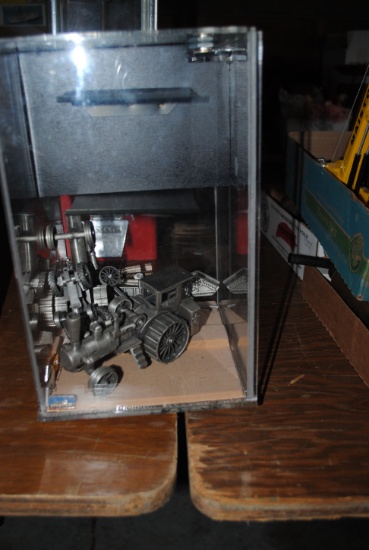 Display case with Case steam engine, threshing machines