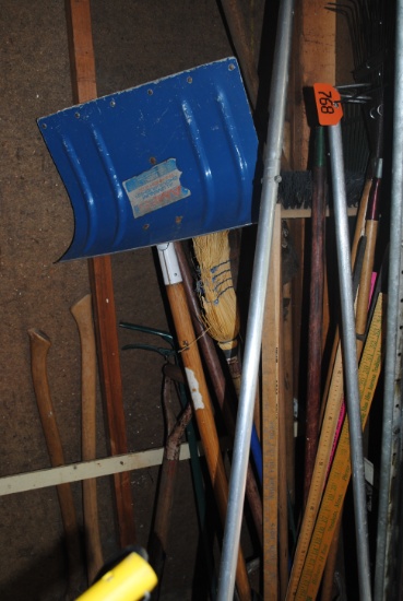 Handled tools including shovels, apple picker, rakes, potato fork, roof rake, axes, step stool, cy