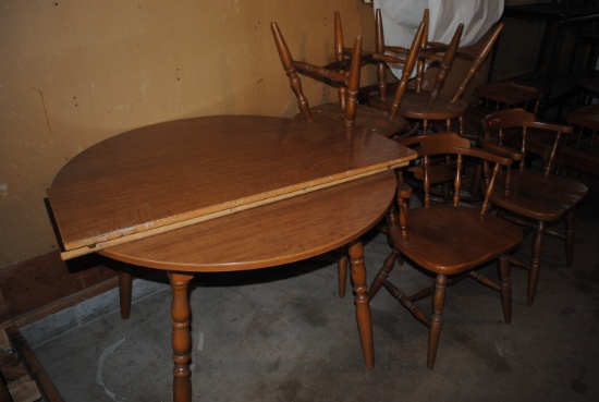 Round wooden table with 2 leaves and 6 chairs