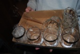 Shelf of crystal, tote of crystal serving platters and bowls