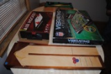 Vibrating football game, table-top air hockey game, and miniature pool table